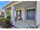 Inviting front porch with double doors and lush landscaping at 7458 Sea Manatee St, Parrish, FL 34219