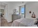 Spacious bedroom with wood-look floors and a dresser at 7458 Sea Manatee St, Parrish, FL 34219