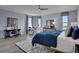 Large bedroom with a bed, desk, and drum set at 7458 Sea Manatee St, Parrish, FL 34219