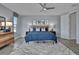 Spacious bedroom with a ceiling fan, plush carpet, and plenty of natural light at 7458 Sea Manatee St, Parrish, FL 34219