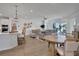Open concept kitchen and living area with island and hardwood floors at 7458 Sea Manatee St, Parrish, FL 34219
