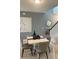 Dining room with a small table and four chairs, near staircase at 9230 Gulf Haven Dr, Parrish, FL 34219
