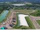 Aerial view of new homes surrounding a lake at 9246 Gulf Haven Dr, Parrish, FL 34219