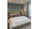 Main bedroom with plush bedding and en suite bathroom at 9246 Gulf Haven Dr, Parrish, FL 34219