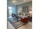 Cozy living room with comfortable seating and access to a patio at 9246 Gulf Haven Dr, Parrish, FL 34219