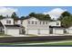 Modern three-story townhomes with attached garages at 9246 Gulf Haven Dr, Parrish, FL 34219