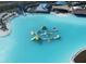 Aerial view of a resort-style pool with floating playground at 9246 Gulf Haven Dr, Parrish, FL 34219