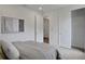Guest bedroom with large closet and grey bedding at 7450 Sea Manatee St, Parrish, FL 34219