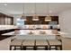 Large kitchen island with seating for five and stylish pendant lighting at 7450 Sea Manatee St, Parrish, FL 34219