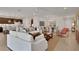 Open concept living area with kitchen and dining views at 7438 Sea Manatee St, Parrish, FL 34219