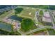 Aerial view of a developing community with ponds at 7438 Sea Manatee St, Parrish, FL 34219