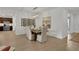 Modern dining room with a wooden table and chandelier at 7438 Sea Manatee St, Parrish, FL 34219