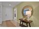 Elegant entryway with a console table, mirror, and view to living room at 7438 Sea Manatee St, Parrish, FL 34219