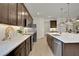 Open kitchen boasting stainless steel appliances and an island at 7438 Sea Manatee St, Parrish, FL 34219