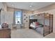 bedroom with a bunk bed and small table and chairs at 7438 Sea Manatee St, Parrish, FL 34219