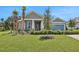 One-story house with gray siding and blue door at 7438 Sea Manatee St, Parrish, FL 34219