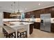 Modern kitchen with a large center island and pendant lighting at 7438 Sea Manatee St, Parrish, FL 34219
