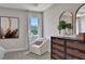 Bedroom sitting area featuring comfy chair and dresser at 7434 Sea Manatee St, Parrish, FL 34219