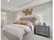 Bright bedroom with king-size bed and accent wall at 7434 Sea Manatee St, Parrish, FL 34219