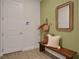 Inviting entryway with built-in bench and stylish decor at 7434 Sea Manatee St, Parrish, FL 34219