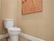 Small bathroom with toilet and art piece at 7434 Sea Manatee St, Parrish, FL 34219