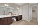 Double vanity bathroom with large mirror and shower at 7434 Sea Manatee St, Parrish, FL 34219