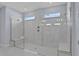 Large walk-in shower with marble tile and built-in seating at 7457 Sea Manatee St, Parrish, FL 34219