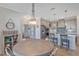 Round dining table with chairs located next to the kitchen at 9234 Gulf Haven Dr, Parrish, FL 34219