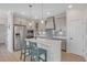 Modern kitchen with island, stainless steel appliances, and shaker cabinets at 9234 Gulf Haven Dr, Parrish, FL 34219