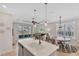 Modern kitchen with island, stainless steel appliances, and white cabinetry at 7610 Sea Oak Ct, Parrish, FL 34219