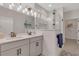 Double vanity bathroom with a large walk-in shower and modern fixtures at 7610 Sea Oak Ct, Parrish, FL 34219