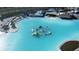 Aerial view of a lagoon pool with inflatable obstacles at 7614 Sea Oak Ct, Parrish, FL 34219