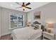 Charming bedroom with a queen-size bed and window seat at 7626 Sea Oak Ct, Parrish, FL 34219