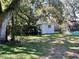 Spacious backyard with shed and partial view of a pool at 4652 Naftis Ln, New Port Richey, FL 34652