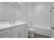 Bright bathroom features a white vanity with solid surface counters and tiled shower and tub at 176 Eagleston Ln, Lakewood Ranch, FL 34240