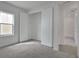 Bedroom featuring neutral carpet, window, and a walk in closet at 176 Eagleston Ln, Lakewood Ranch, FL 34240