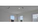 White ceiling featuring a light fixture and air conditioning vent, illuminated by natural light from nearby windows at 176 Eagleston Ln, Lakewood Ranch, FL 34240