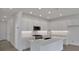 Spacious kitchen with a large center island, stainless steel appliances, and sleek white cabinetry at 176 Eagleston Ln, Lakewood Ranch, FL 34240