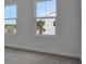 Cozy bedroom featuring carpet flooring and two windows that provide plenty of natural light at 176 Eagleston Ln, Lakewood Ranch, FL 34240