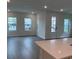 Bright and spacious living area with hardwood floors and large windows at 176 Eagleston Ln, Lakewood Rch, FL 34240