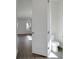 Bathroom featuring a white toilet and wood-look tile flooring at 180 Eagleston Ln, Lakewood Ranch, FL 34240