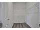 Walk-in closet with white walls and metal shelves for storage at 180 Eagleston Ln, Lakewood Ranch, FL 34240