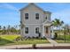 Charming two-story home with a well-manicured lawn and a welcoming pink front door at 180 Eagleston Ln, Lakewood Ranch, FL 34240