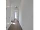 Hallway with wood-look tile flooring and neutral paint at 180 Eagleston Ln, Lakewood Ranch, FL 34240