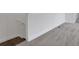 Upstairs hallway featuring neutral walls, hardwood stairs, and plush gray carpet at 180 Eagleston Ln, Lakewood Ranch, FL 34240
