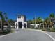 Elegant community clubhouse with palm trees and a welcoming entrance at 5013 Sevilla Shores Dr, Wimauma, FL 33598