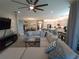 Open concept living room with a view of the kitchen and dining area at 5013 Sevilla Shores Dr, Wimauma, FL 33598