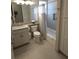 Modern bathroom with a tub, shower, and updated vanity at 5013 Sevilla Shores Dr, Wimauma, FL 33598