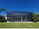Large screened enclosure protects the pool and patio from the elements at 5013 Sevilla Shores Dr, Wimauma, FL 33598
