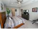 Comfortable main bedroom with a king-size bed and walk-in closet at 5013 Sevilla Shores Dr, Wimauma, FL 33598